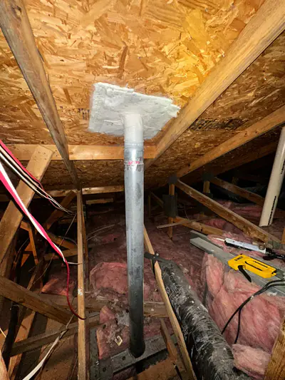 Dryer vent ducting routed through an attic