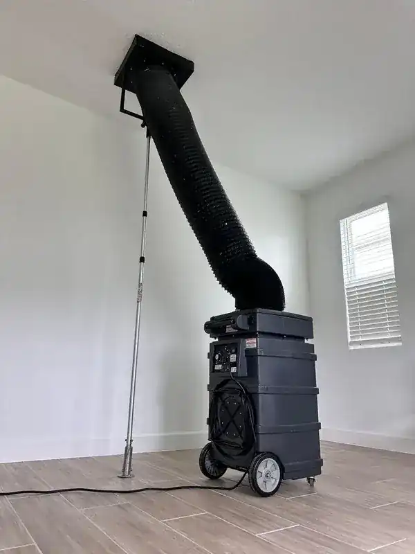 TOP 1 Duct Cleaning technician with professional vacuum equipment in an Orlando home